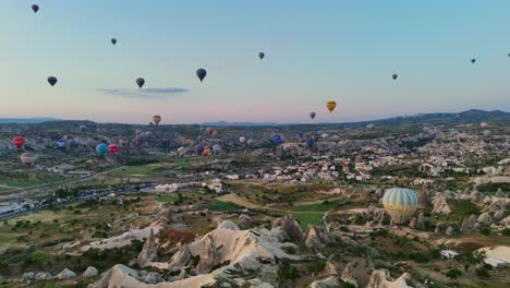 hot air balloons at sunrise over cappadocia's unique landscapes