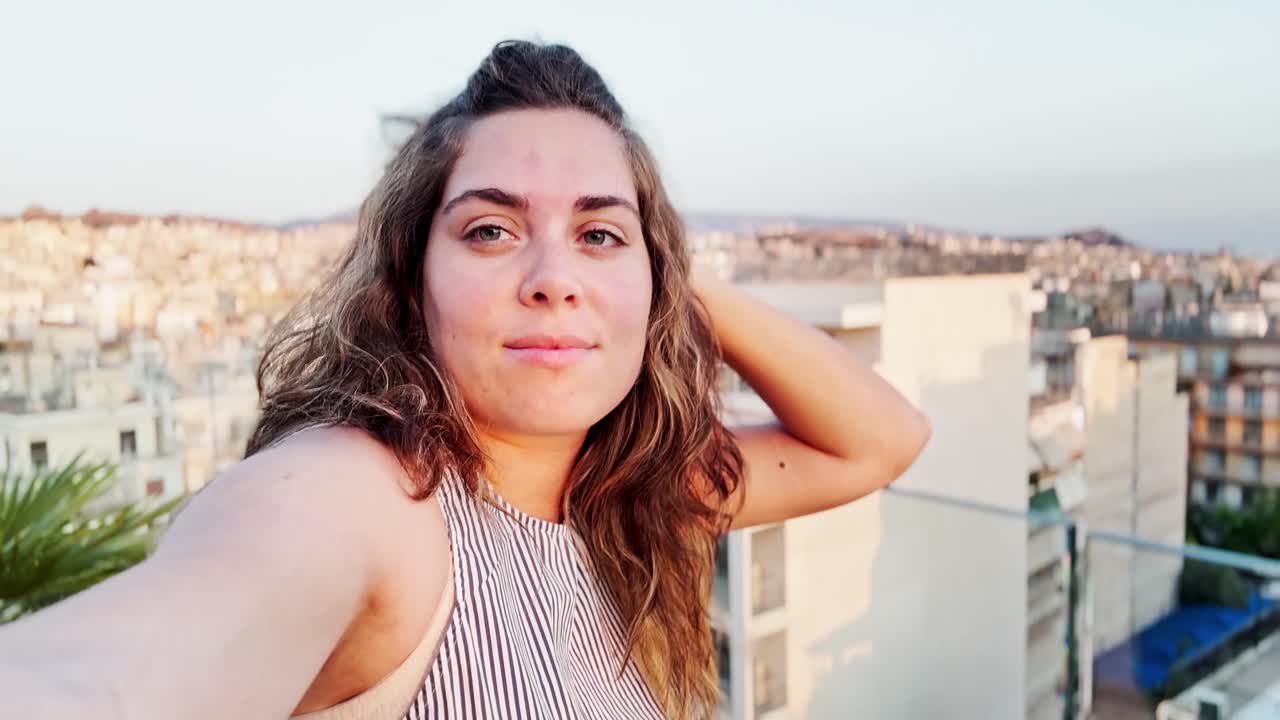 Relaxed Woman Vlogging Athens Rooftop View at Dusk