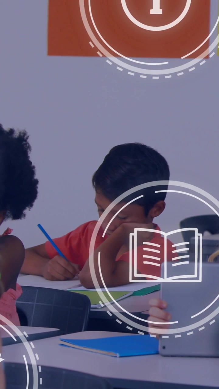 Vertical video: Boy writing at desk while school icons appearing, overlaying desks, aiding learning