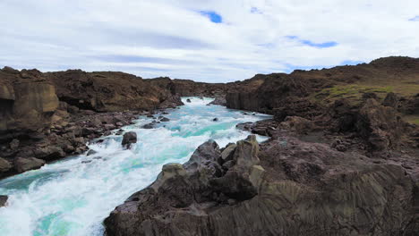 drone aerial view of the aldeyjarfoss waterfall in north iceland.