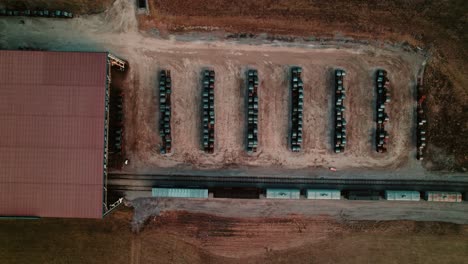 coil storage: top down aerial view of industrial metal next to private rail road for transporting raw materials