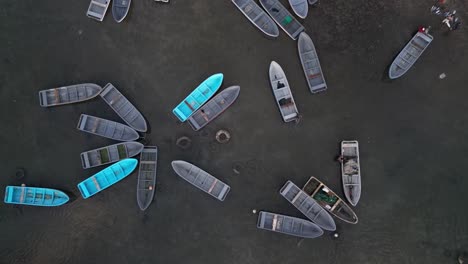 Aerial-birds-eye-view-of-empty-wooden-fishing-boats-in-Port-Badjanan-at-Moroni,-Comoros