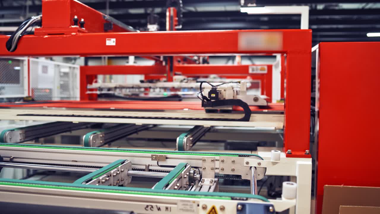 Industrial robot working at solar pannels production factory,Conveyor Tracking Controler of robotic hand. Green energy concept.