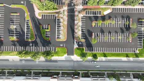 up-top-view-empty-new-parking-lot-with-cars-driving-in-the-main-road-at-Rancho-Cucamonga-CA