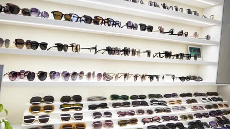 sunglasses elegantly displayed on shop shelves in a bustling shopping mall in danyang, jiangsu province, china. slow-motion footage captures the vibrant colors and styles.