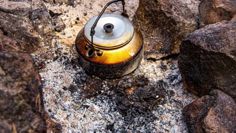cooking soup and boiling water on a campfire