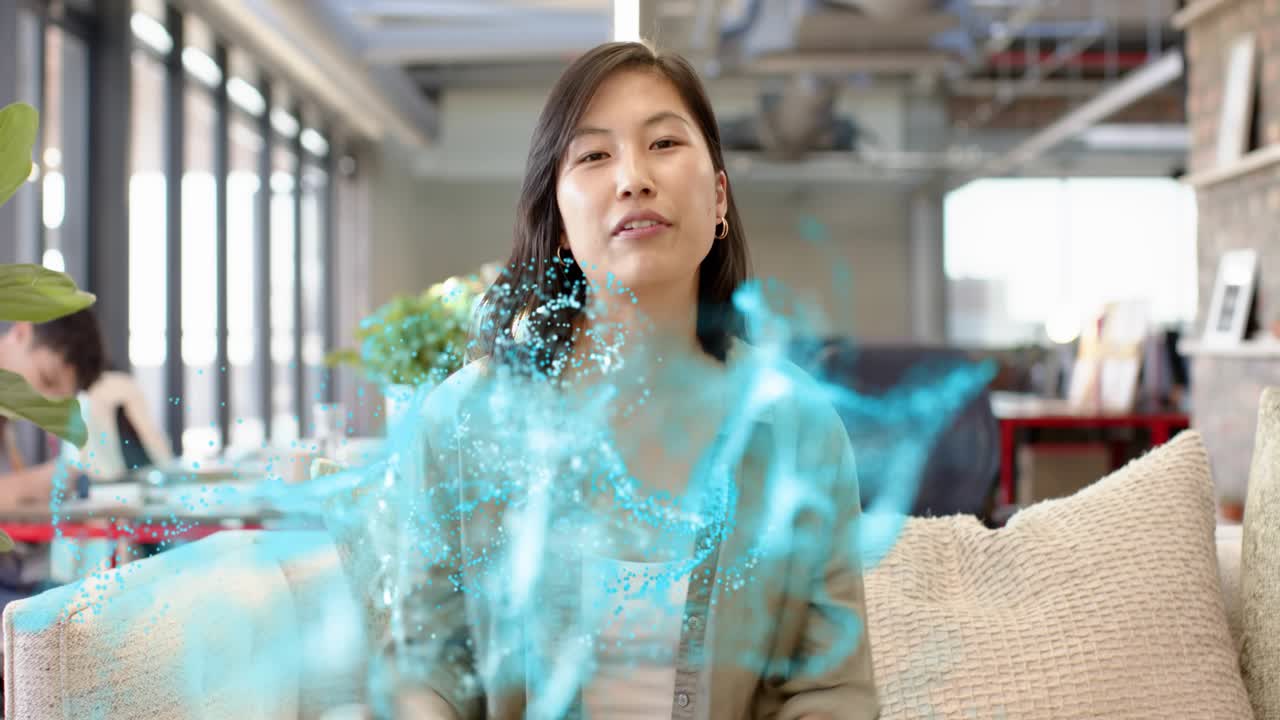 Woman speaking and gesturing in lounge starting blue wave moving over torso, showing business idea