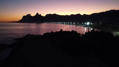 flying backwards in rio de janeiro`s sunset