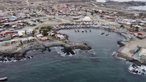 aerial orbits protected fishing harbour, caleta chanaral, chile coast