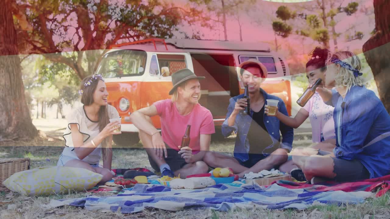 Animation of flag of netherlands over diverse group of friends having party outdoors
