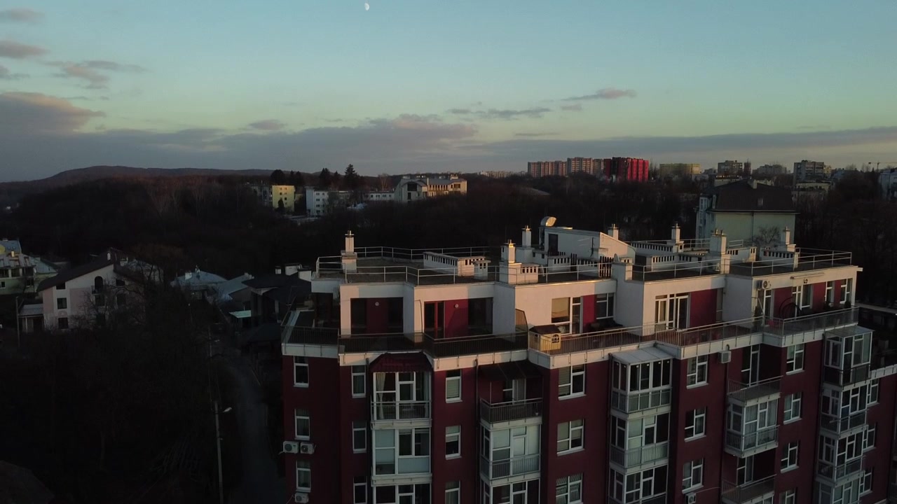 Aerial view of a drone flying over the residential building.