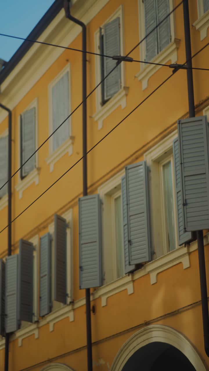 Italian Building Facade with Shutters