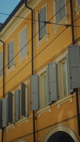 italian building facade with shutters