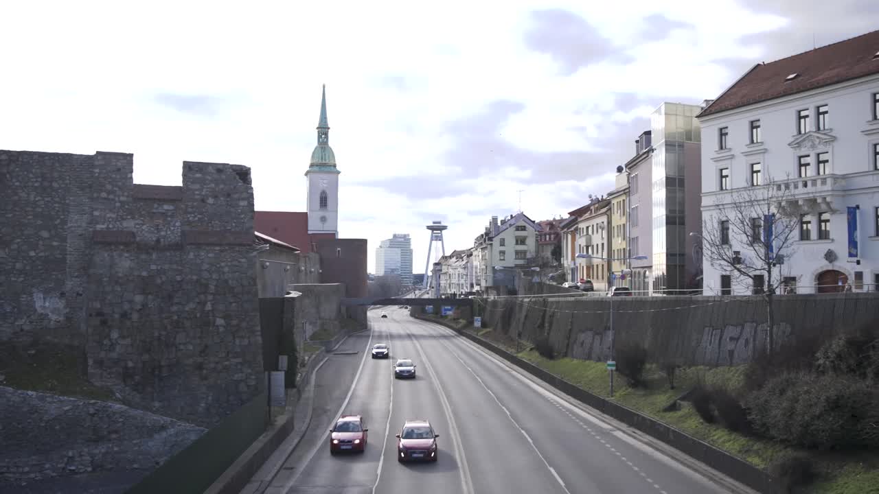 Car traffic on a highway road in historical center of Bratislava city