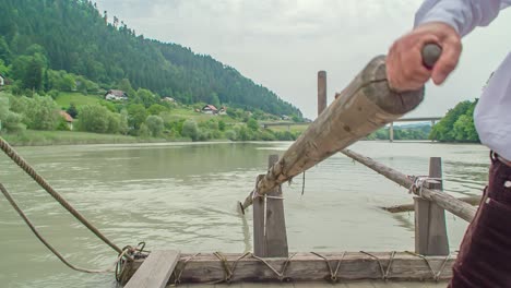 Man-with-Shirt-and-Tie,-Paddling-Traditional-Wooden-Riverboat,-CLOSE-UP