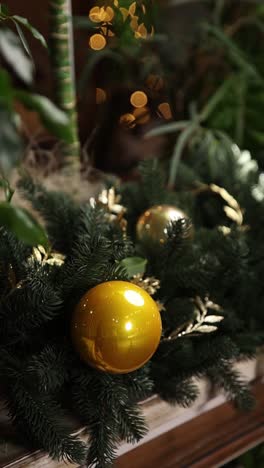 christmas decoration with golden ornaments and plants