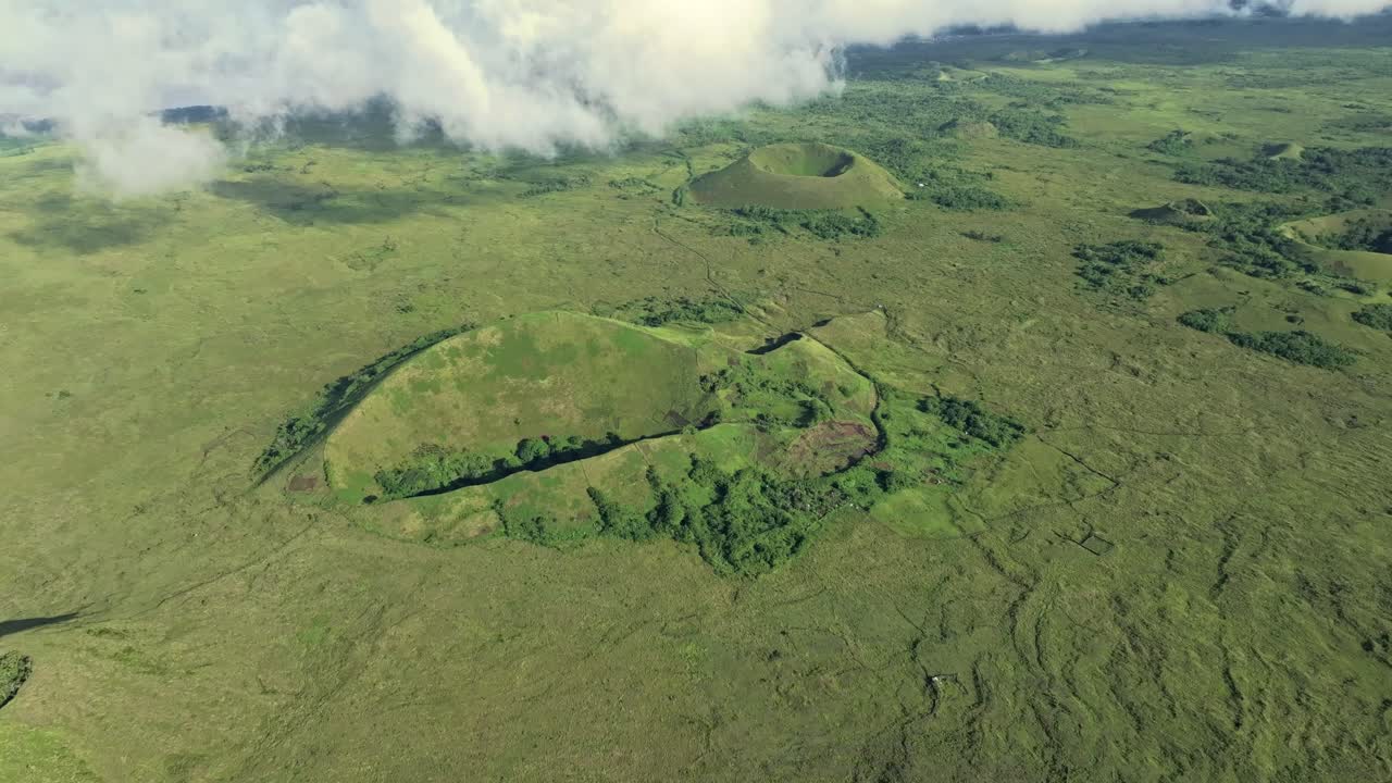 Comoros - Grande Comore - Diboini - tilt up view on the external craters with clouds