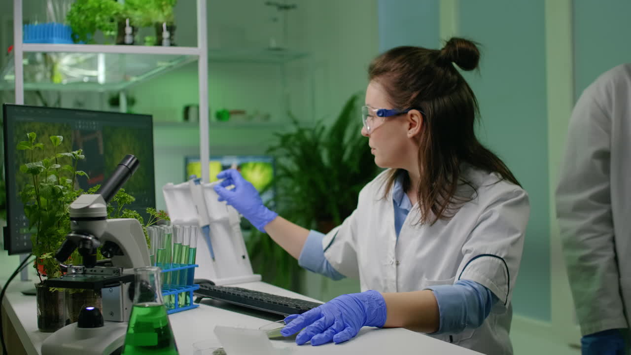 Chemist scientist taking dna solution from test tube with micropipette