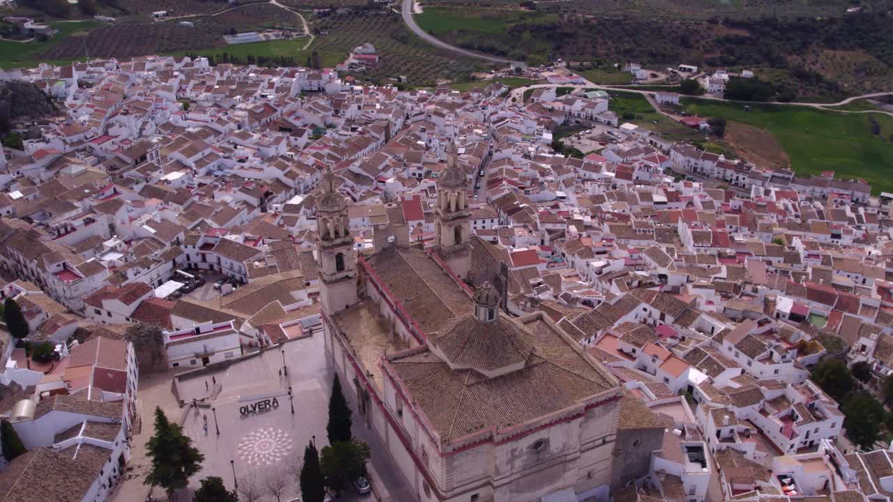 Iglesia Mayor Parroquial y Arcipestral Nuestra Se&ntilde;ora de la Encarnaci&oacute;n with view over Olvera Spain, aerial