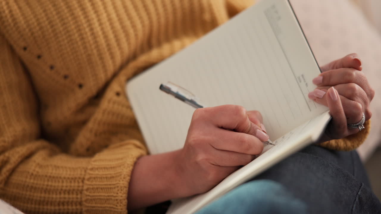 Person writing in a notebook