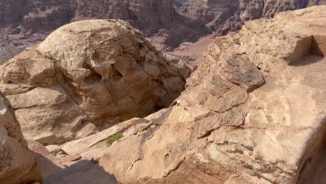 looking down at steps carved into the sandstone above petra, jordan