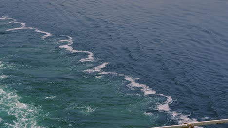 ferry ship wake from propellers on calm ocean sea in slow motion 4k