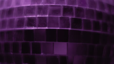 close up of a disco ball changing colors