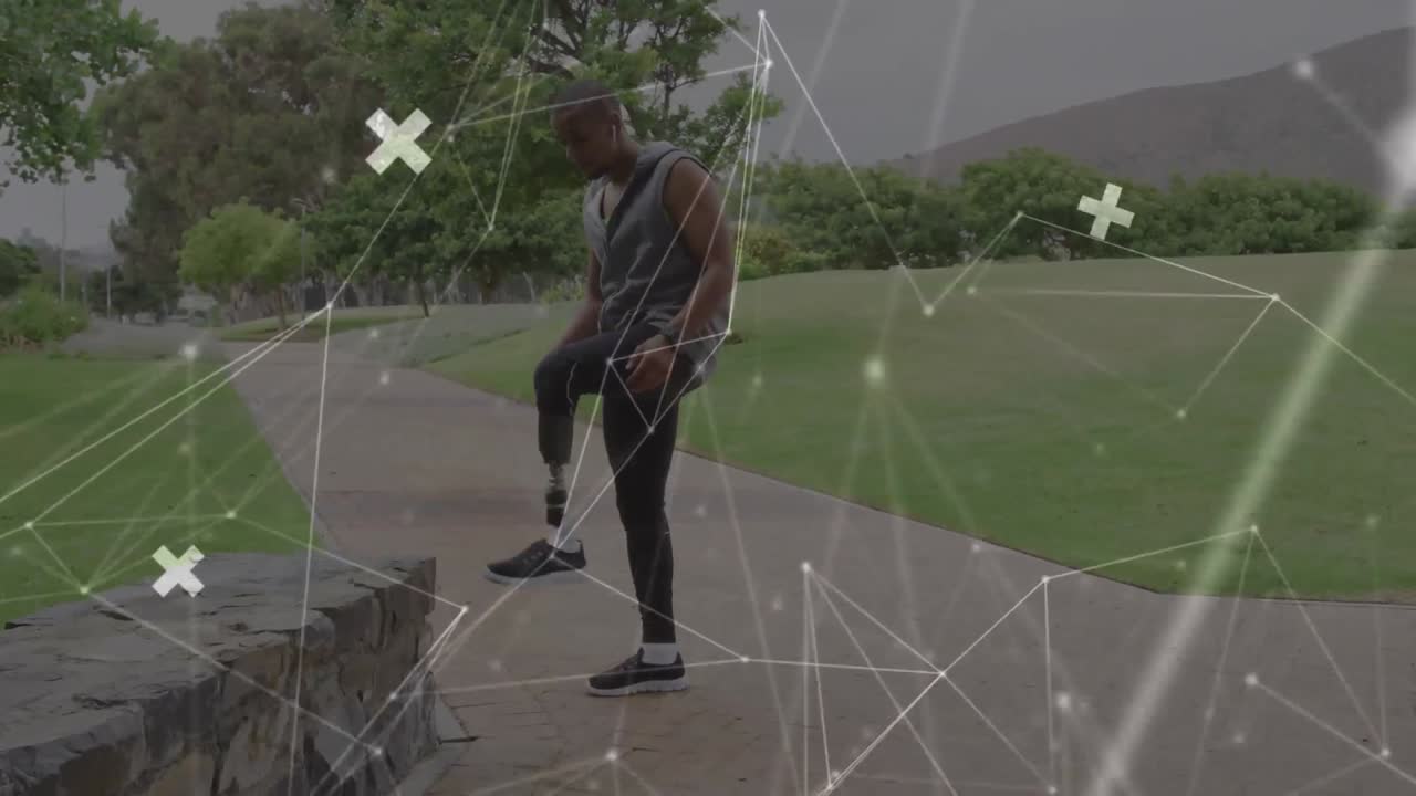 Animation of communication network moving over male athlete with prosthetic leg exercising outdoors