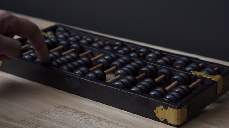 Using An Abacus To Make Calculations
