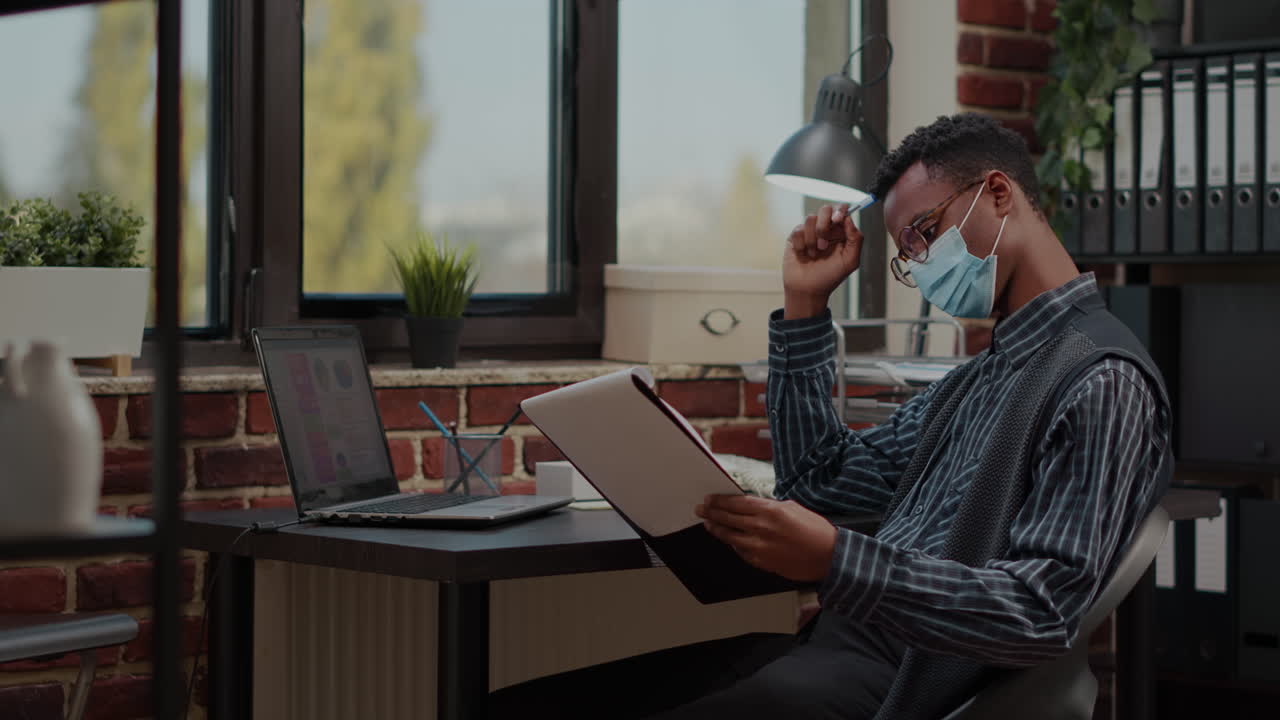Employee expressing doubt and working on financial report
