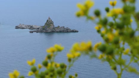 small stone church on a hill in a little island by the sea, southern europe