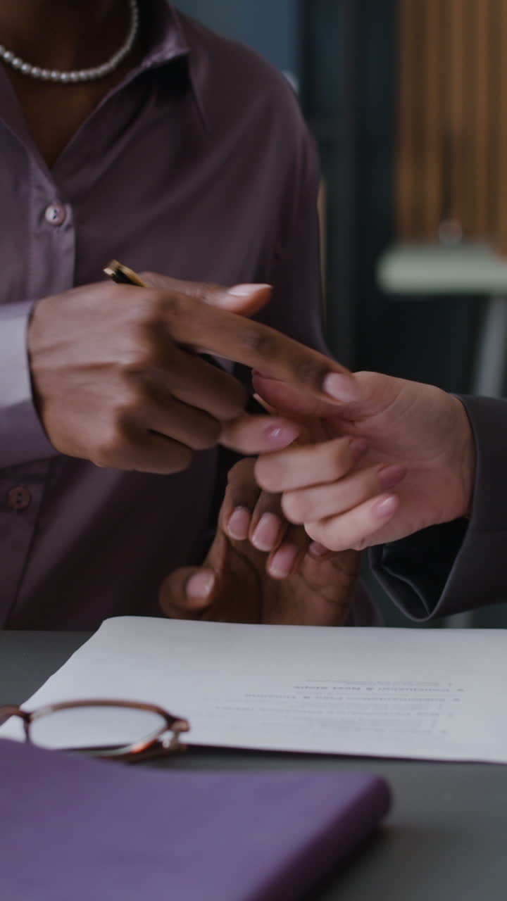 Business people signing documents