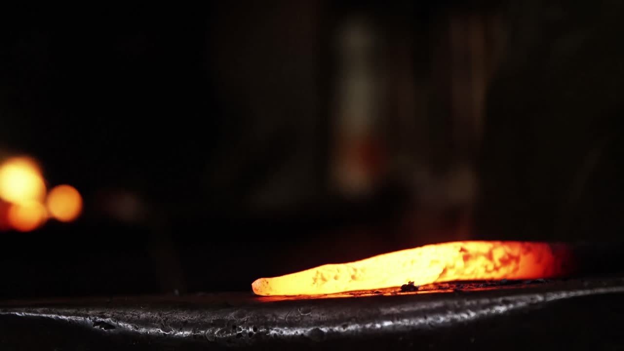 Close-up of blacksmith working on a iron rod