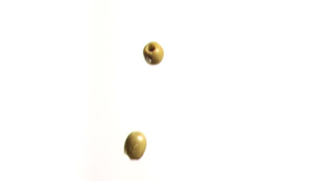 olives falling in super slow motion