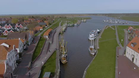 drone flight over a tranquil fishing village in germany