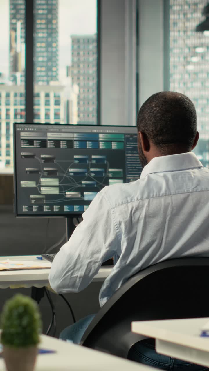Vertical Video Diverse coworkers in office working on analytics and forecasting