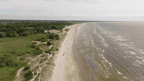 aerial view flying along the parnu beach, sunny, summer day in estonia