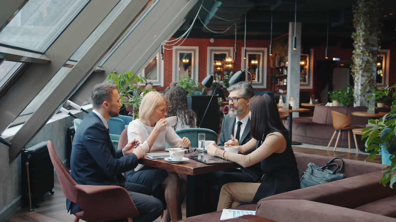 Business Meeting in a Modern Cafe