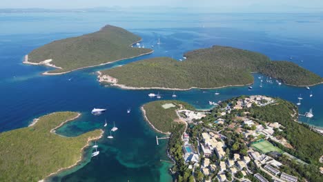 syvota islands, coastal village and boats in ionian sea, epirus, greece mainland - aerial