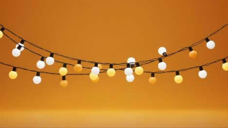 vibrant and whimsical string lights adorning a warm orange background, perfect for adding a cozy ambiance to any space with their playful design and charming glow