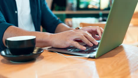 Laptop,-coffee-shop-hands-and-person-typing-online