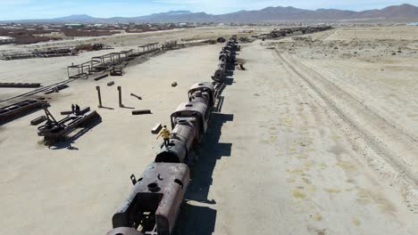 Train surfing Uyuni desert cemetery Bolivia graveyard tourist attraction, aerial drone South America