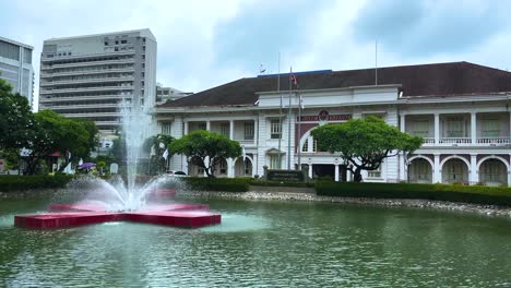 in front of the classic building of the thai red cross society.