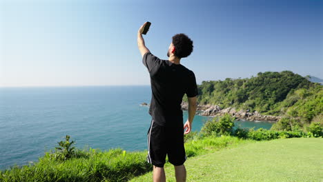 young man social media creator documenting tropical journey, remote work and digital freedom concept