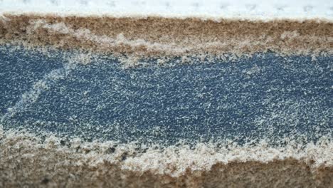 close-up of sandpaper with wood dust