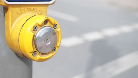 yellow pedestrian crossing button