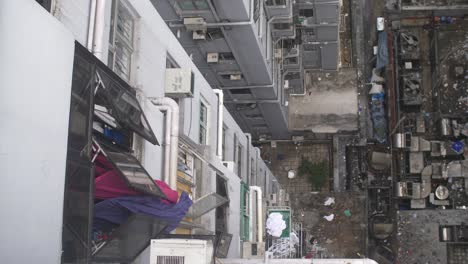 looking down at grubby apartment building