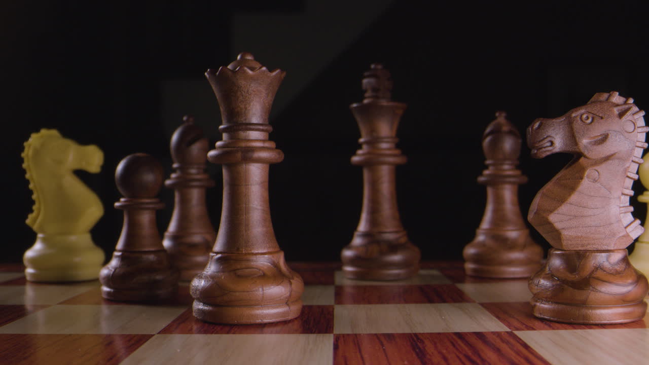 Chess. Queen takes pawn. Macro slow motion.