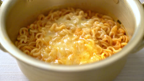 korean spicy instant noodle bowl with mozzarella cheese