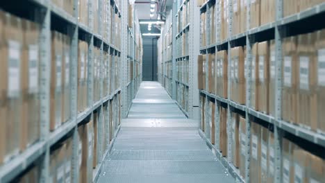 automated warehouse robot is riding past a corridor